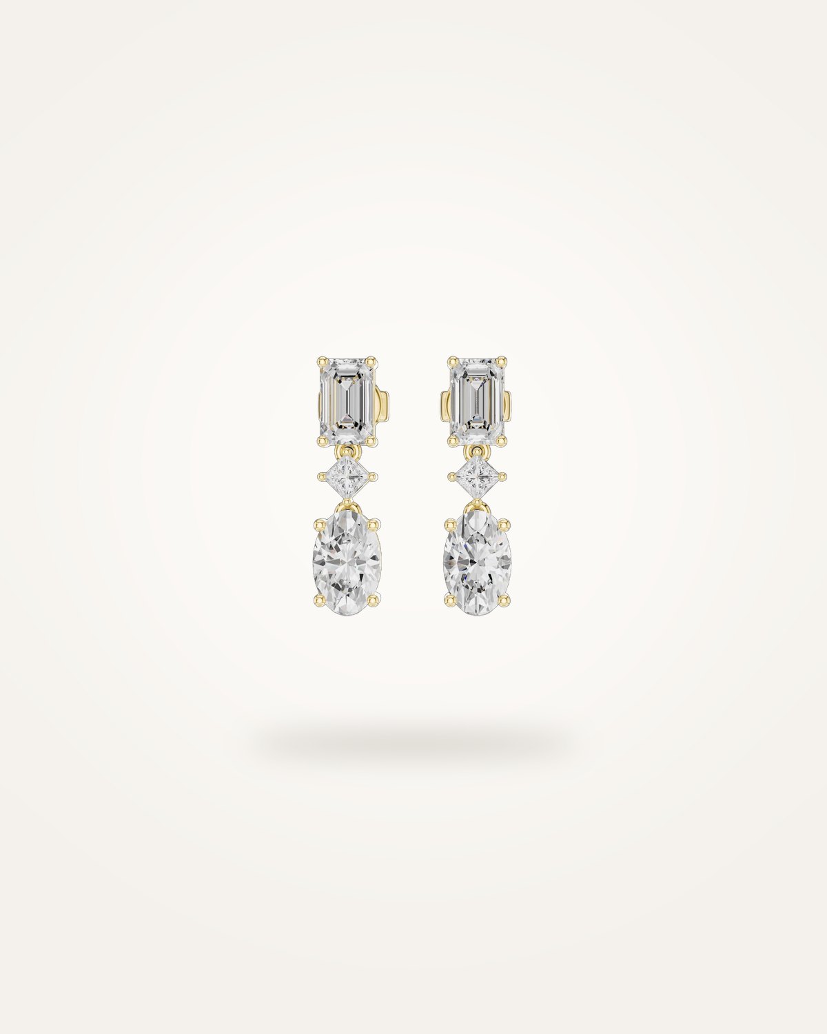 Emerald and oval-cut diamond drop earrings